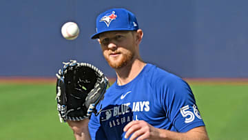 Oct 3, 2025; Toronto, Ontario, Canada; Toronto Blue Jays pitcher Eric Lauer (56) fields the ball during workouts at Rogers Centre. Mandatory Credit: Dan Hamilton-Imagn Images