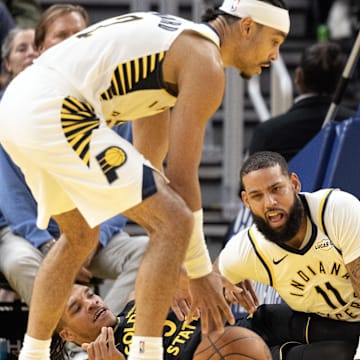 Nov 9, 2025; San Francisco, California, USA; Golden State Warriors guard Will Richard (3) and Indiana Pacers forward Cody Martin (11) fall to the floor while Indiana Pacers guard Andrew Nembhard (2) picks up the loose ball they were fighting for during the fourth quarter at Chase Center. Mandatory Credit: D. Ross Cameron-Imagn Images