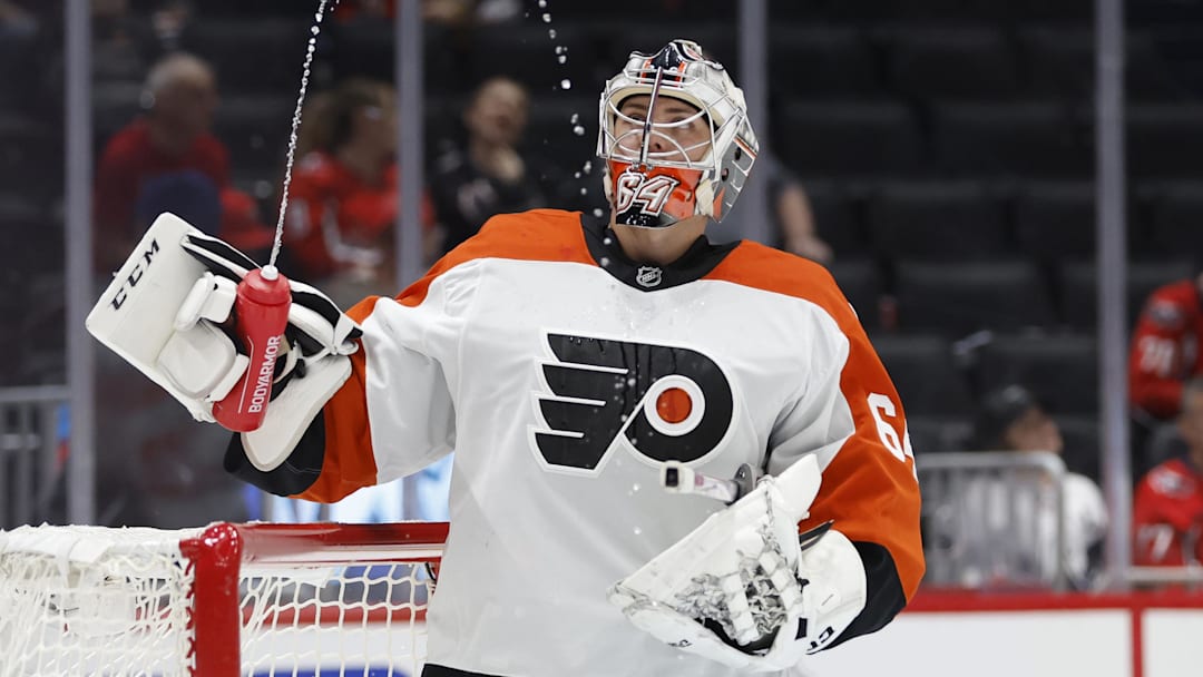 Sep 22, 2024; Washington, District of Columbia, USA; Philadelphia Flyers goaltender Carson Bjarnason (64) watches water squirted from his bottle during a timeout against the Washington Capitals in the third period at Capital One Arena.