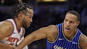 Orlando Magic guard Desmond Bane is guarded by New York Knicks guard Jalen Brunson.
