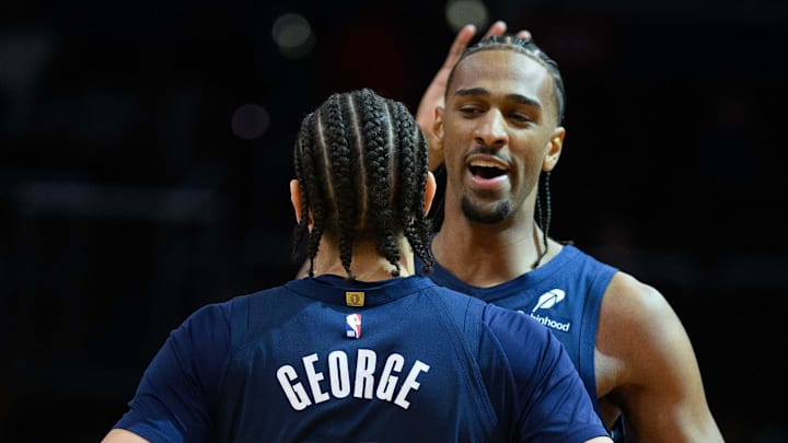Mar 5, 2025; Washington, District of Columbia, USA; Washington Wizards forward Alex Sarr (20) celebrates with forward Kyshawn George (18) during the fourth quarter against the Utah Jazz at Capital One Arena. Mandatory Credit: Reggie Hildred-Imagn Images