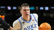 Apr 5, 2025; San Antonio, TX, USA; Duke Blue Devils forward Cooper Flagg (2) controls the ball against Houston Cougars forward J'Wan Roberts (13) during the second half in the semifinals of the men's Final Four of the 2025 NCAA Tournament at the Alamodome. Mandatory Credit: Bob Donnan-Imagn Images