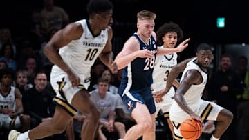 Vanderbilt guard Duke Miles (2) comes up with the ball after teammate guard Tyler Tanner (3) poked the ball away from Virginia forward Thijs De Ridder (28) during the first half of their exhibition game at Memorial Gym in Nashville, Tenn., Thursday, Oct. 16, 2025.