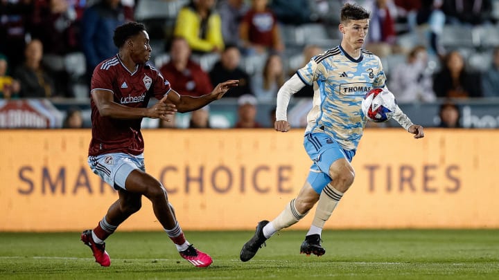 May 13, 2023; Commerce City, Colorado, USA; Philadelphia Union forward Chris Donovan (25) fields the ball ahead of Colorado Rapids defender Moise Bombito (64) in the second half at Dick's Sporting Goods Park. Mandatory Credit: Isaiah J. Downing-USA TODAY Sports