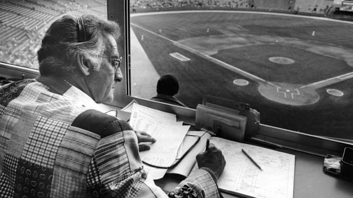 Bob Uecker in the Milwaukee County Stadium broadcast booth.