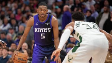 Mar 12, 2024; Sacramento, California, USA; Sacramento Kings guard De'Aaron Fox (5) controls the ball against Milwaukee Bucks forward Giannis Antetokounmpo (34) during the fourth quarter at Golden 1 Center. Mandatory Credit: Ed Szczepanski-USA TODAY Sports