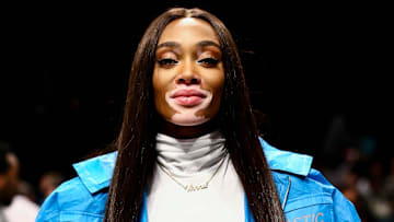 Model Winnie Harlow stuns in a blue jacket at the Los Angeles Clippers and Brooklyn Nets Game at Barclays Center. 