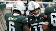 Oct 11, 2025; East Lansing, Michigan, USA; Michigan State wide receiver Nick Marsh (6) celebrates a touchdown against the UCLA Bruins with quarterback Alessio Milivojevic (11) in the fourth quarter at Spartan Stadium.