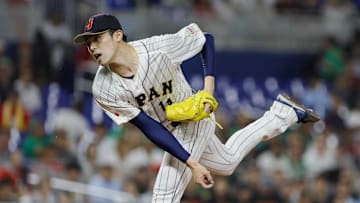 Mar 20, 2023; Miami, Florida, USA; Japan starting pitcher Roki Sasaki (14) delivers a pitch during the first inning against Mexico at LoanDepot Park. 