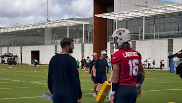 Jacksonville Jaguars quarterback Trevor Lawrence (16) talks with offensive coordinator Press Taylor during practice on Nov. 7 at the Miller Electric Center. Lawrence was limited for a second day in a row because of a left shoulder injury.