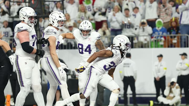 Dec 25, 2025; Minneapolis, Minnesota, USA; Minnesota Vikings running back Aaron Jones Sr. (33) celebrates after scoring a touchdown against the Detroit Lions in the first quarter at U.S. Bank Stadium. Mandatory Credit: Matt Krohn-Imagn Images