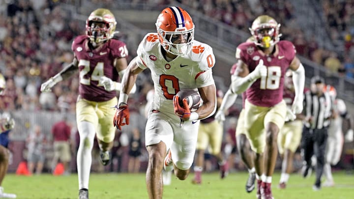 Oct 5, 2024; Tallahassee, Florida, USA; Clemson Tigers wide receiver Antonio Williams (0) scores a touchdown against the Florida State Seminoles during the first half at Doak S. Campbell Stadium. Mandatory Credit: Melina Myers-Imagn Images