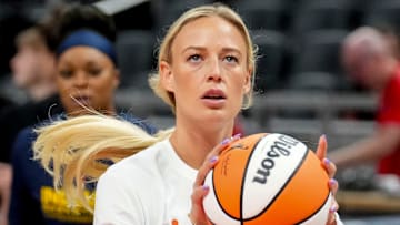 Indiana Fever guard Sophie Cunningham warms up before a game.