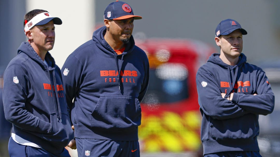 May 9, 2025; Lake Forest, IL, USA; Chicago Bears defensive coordinator Dennis Allen (L), general manager Ryan Poles (C) and head coach Ben Johnson (R) observe during the Rookie Minicamp at Halas Hall.