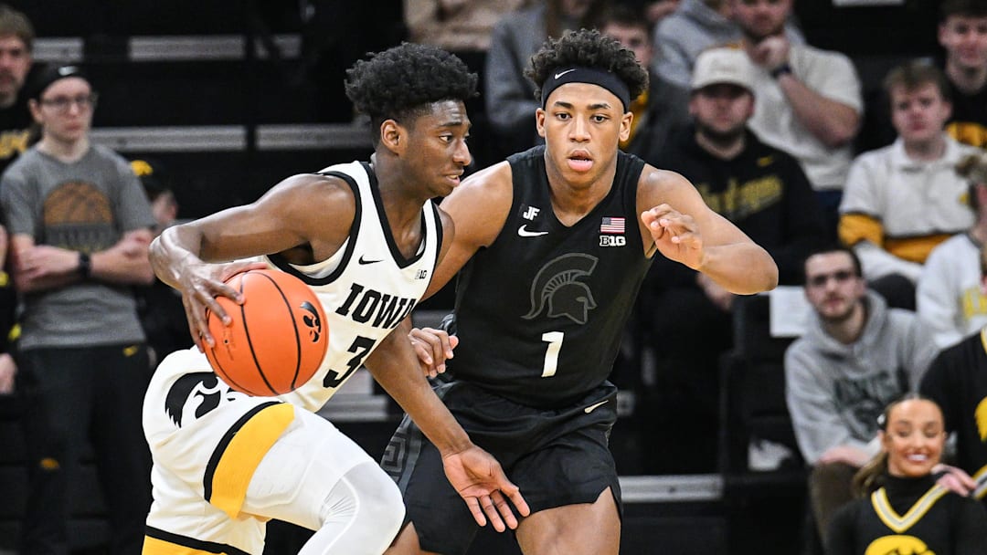Mar 6, 2025; Iowa City, Iowa, USA; Iowa Hawkeyes guard Drew Thelwell (3) controls the ball as Michigan State Spartans guard Jeremy Fears Jr. (1) defends during the first half at Carver-Hawkeye Arena.