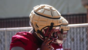 FSU football players walk into the first spring practice of the spring season on Wednesday, March 19, 2025