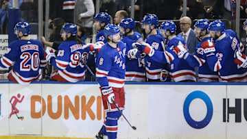 Jan 4, 2024; New York, New York, USA; New York Rangers defenseman Jacob Trouba (8) celebrates with his teammates after scoring a goal in the third period against the Chicago Blackhawks at Madison Square Garden. Mandatory Credit: Wendell Cruz-Imagn Images