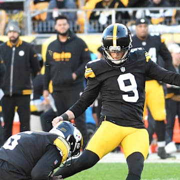 Nov 12, 2023; Pittsburgh, Pennsylvania, USA;  Pittsburgh Steelers kicker Chris Boswell (9) makes a 35 yard field goal as Pressley Harvin III (6) holds the ball against the Green Bay Packers during the fourth quarter at Acrisure Stadium. Mandatory Credit: Philip G. Pavely-Imagn Images