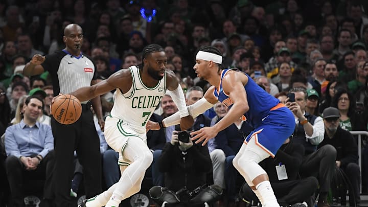 Apr 11, 2024; Boston, Massachusetts, USA;  Boston Celtics guard Jaylen Brown (7) controls the ball while New York Knicks guard Josh Hart (3) defends during the first half at TD Garden. Mandatory Credit: Bob DeChiara-Imagn Images