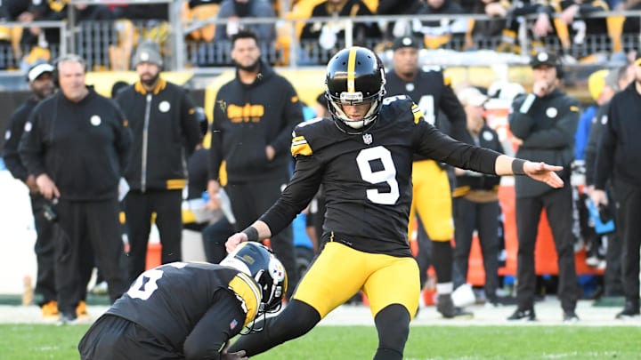 Nov 12, 2023; Pittsburgh, Pennsylvania, USA;  Pittsburgh Steelers kicker Chris Boswell (9) makes a 35 yard field goal as Pressley Harvin III (6) holds the ball against the Green Bay Packers during the fourth quarter at Acrisure Stadium. Mandatory Credit: Philip G. Pavely-Imagn Images