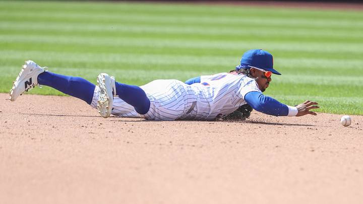 Jul 12, 2026; New York City, New York, USA;  New York Mets shortstop Francisco Lindor (12) makes an error in the ninth inning against the Boston Red Sox at Citi Field. Mandatory Credit: Wendell Cruz-Imagn Images