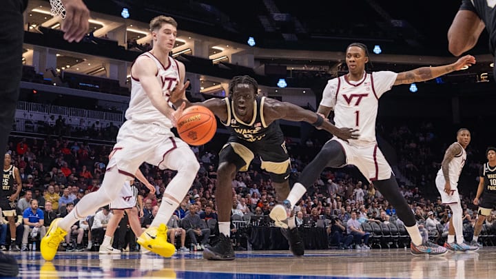March 10, 2026: Virginia Tech Hokies guard Neoklis Avdalas (17) and Wake Forest Demon Deacons forward Omaha Biliew (0) chase a loose ball during the first half of the 2025 ACC Men's Basketball Championship at Spectrum Center in Charlotte, NC. (Scott Kinser)