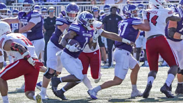 Aug 31, 2024; Evanston, Illinois, USA; Northwestern Wildcats running back Cam Porter (1) runs against the Miami (Oh) Redhawks during the first half at Lanny and Sharon Martin Stadium. Mandatory Credit: David Banks-USA TODAY Sports