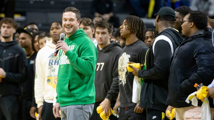 Oregon head football coach Dan Lanning and his team address the crowd during a timeout as the Oregon Ducks host the Arizona Wildcats Saturday, Jan. 27, 2024 at Matthew Knight Arena in Eugene, Ore.