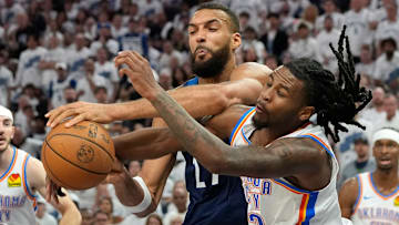 Minnesota Timberwolves center Rudy Gobert attempts to shoot the ball against Oklahoma City Thunder guard Cason Wallace in the second half during Game 4 of the Western Conference finals at Target Center in Minneapolis on May 26, 2025. 