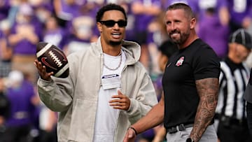 Seattle Seahawks wide receiver Jaxon Smith-Njigba talks to Ohio State Buckeyes offensive coordinator Brian Hartline prior to the NCAA football game against the Washington Huskies at Husky Stadium in Seattle on Sept. 27, 2025.