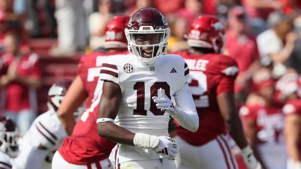 Mississippi State Bulldogs safety Corey Ellington celebrates after a stop against the Arkansas Razorbacks.