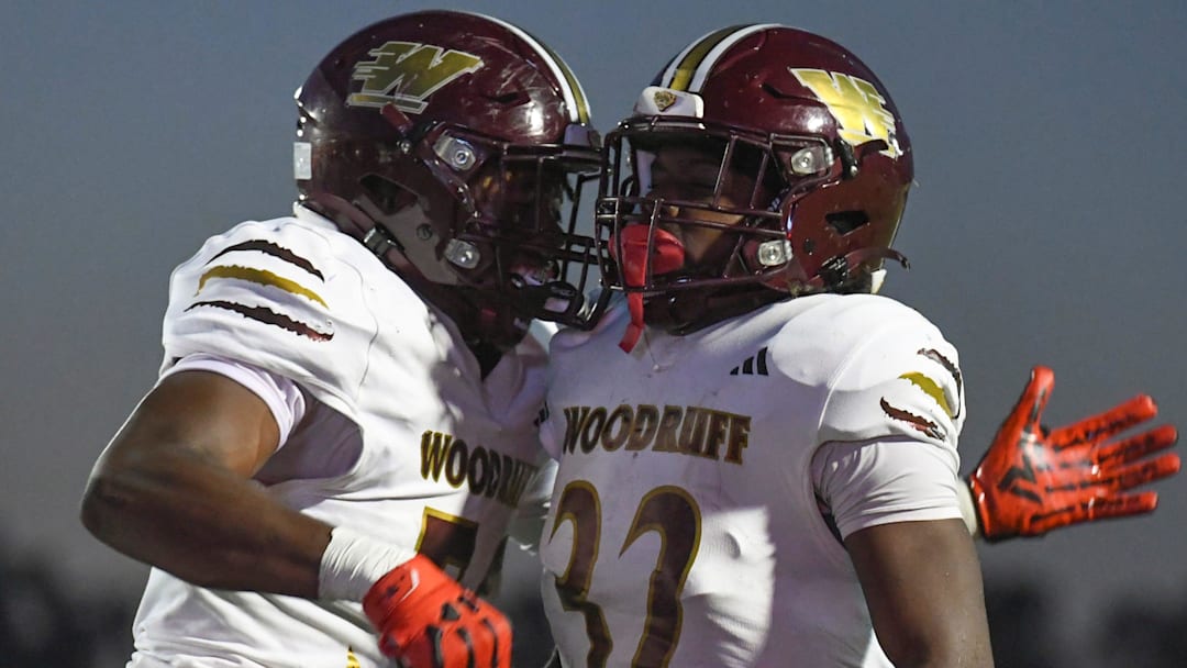 Woodruff Wolverines Grayson Patterson (56) and Woodruff Wolverines Aiden Gibson (32) celebrate after a touchdown Friday, Sept. 12, 2025 during the SCHSL football game against the Woodmont Wildcats at Woodmont High School in Piedmont, South Carolina.