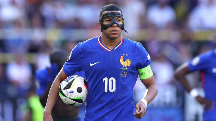 Mbappe is playing in a face mask