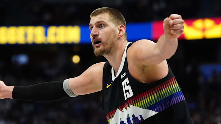Apr 4, 2026; Denver, Colorado, USA; Denver Nuggets center Nikola Jokic (15) reacts towards a referee against the San Antonio Spurs at Ball Arena. Mandatory Credit: Ron Chenoy-Imagn Images