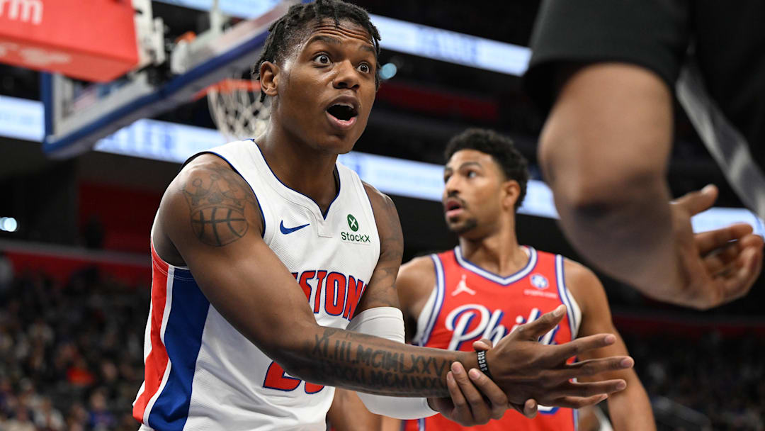 Mar 12, 2026; Detroit, Michigan, USA;  Detroit Pistons guard Marcus Sasser (25) argues with referee Tony Brothers (25) that he should have had a foul called on the Philadelphia 76ers when he was driving to the basket during the first half at Little Caesars Arena.