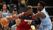 Nov 8, 2023; Memphis, Tennessee, USA; Miami Heat center Bam Adebayo (13) dribbles as Memphis Grizzlies forward-center Jaren Jackson Jr. (13) defends during the second half at FedExForum. Mandatory Credit: Petre Thomas-Imagn Images