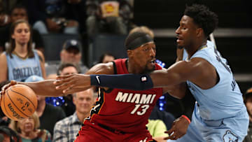 Nov 8, 2023; Memphis, Tennessee, USA; Miami Heat center Bam Adebayo (13) dribbles as Memphis Grizzlies forward-center Jaren Jackson Jr. (13) defends during the second half at FedExForum. Mandatory Credit: Petre Thomas-Imagn Images