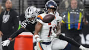 Dec 7, 2025; Paradise, Nevada, USA;  Las Vegas Raiders cornerback Darien Porter (26) breaks up the pass to Denver Broncos wide receiver Courtland Sutton (14) during the second half at Allegiant Stadium. Mandatory Credit: Kirby Lee-Imagn Images