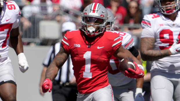 Ohio State Buckeyes running back Quinshon Judkins on a rushing attempt during a college football game.