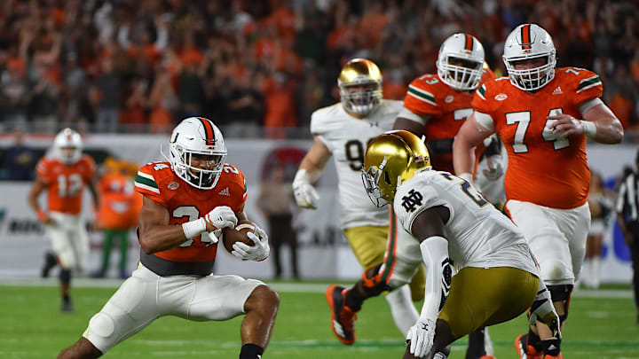 Nov 11, 2017; Miami Gardens, FL, USA; Miami Hurricanes running back Travis Homer (24) runs the ball against the Notre Dame Fighting Irish during the first half at Hard Rock Stadium. Mandatory Credit: Jasen Vinlove-Imagn Images