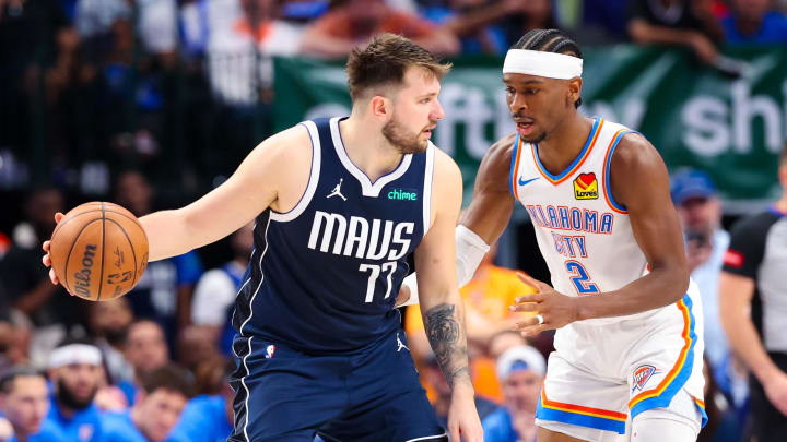 May 11, 2024; Dallas, Texas, USA; Dallas Mavericks guard Luka Doncic (77) controls the ball as Oklahoma City Thunder guard Shai Gilgeous-Alexander (2) defends during the second half during game three of the second round for the 2024 NBA playoffs at American Airlines Center. Mandatory Credit: Kevin Jairaj-USA TODAY Sports