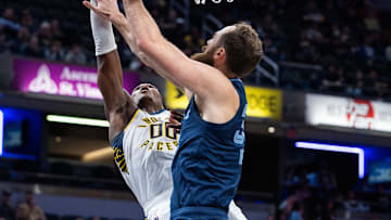 Oct 14, 2024; Indianapolis, Indiana, USA; Indiana Pacers guard Bennedict Mathurin (00) shoots the ball while Memphis Grizzlies center Jay Huff (30) defends in the second half at Gainbridge Fieldhouse. Mandatory Credit: Trevor Ruszkowski-Imagn Images