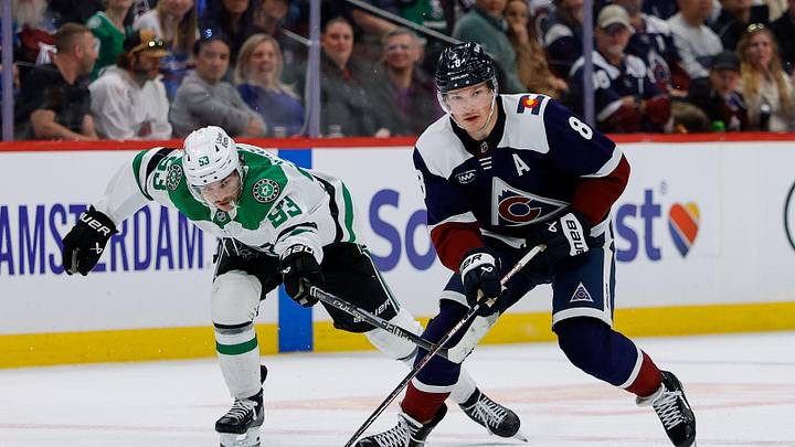 Mar 18, 2026; Denver, Colorado, USA; Colorado Avalanche defenseman Cale Makar (8) controls the puck ahead of Dallas Stars center Wyatt Johnston (53) in overtime at Ball Arena. Mandatory Credit: Isaiah J. Downing-Imagn Images