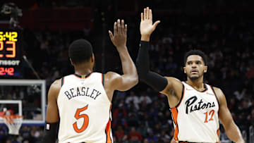 Nov 25, 2024; Detroit, Michigan, USA;  Detroit Pistons guard Malik Beasley (5) and forward Tobias Harris (12) celebrates in the first half against the Toronto Raptors at Little Caesars Arena. Mandatory Credit: Rick Osentoski-Imagn Images