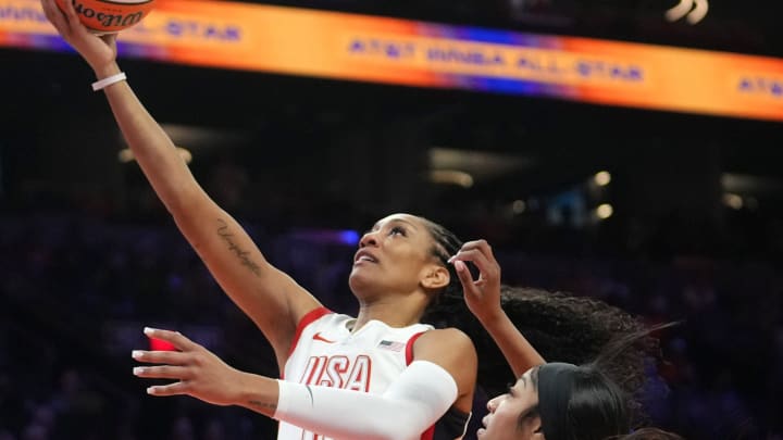 Team USA center A'ja Wilson (9) lays the ball up over Team WNBA forward Angel Reese (5) during the WNBA All-Star Game at Footprint Center in Phoenix on July 20, 2024.