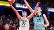 May 24, 2025; Indianapolis, Indiana, USA; Indiana Fever guard Caitlin Clark (22) shoots the ball while New York Liberty forward Breanna Stewart (30) defends in the second half at Gainbridge Fieldhouse. Mandatory Credit: Trevor Ruszkowski-Imagn Images