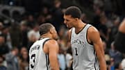Nov 7, 2025; San Antonio, Texas, USA;  San Antonio Spurs forward Victor Wembanyama (1) and San Antonio Spurs forward Keldon Johnson (3) react after gaining the lead at the end of the second quarter against the Houston Rockets at Frost Bank Center. Mandatory Credit: Dustin Safranek-Imagn Images