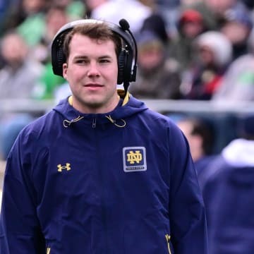 Apr 20, 2024; Notre Dame, IN, USA; Notre Dame Fighting Irish quarterback Riley Leonard watches during the second half of the Blue-Gold game at Notre Dame Stadium. Mandatory Credit: Matt Cashore-USA TODAY Sports