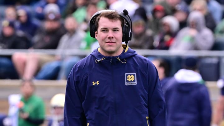 Apr 20, 2024; Notre Dame, IN, USA; Notre Dame Fighting Irish quarterback Riley Leonard watches during the second half of the Blue-Gold game at Notre Dame Stadium. Mandatory Credit: Matt Cashore-USA TODAY Sports