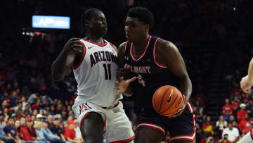 Nov 17, 2023; Tucson, Arizona, USA; Belmont Bruins forward Malik Dia (4) drives to the net against Arizona Wildcats center Oumar Ballo (11) during the first half at McKale Center. Mandatory Credit: Zachary BonDurant-USA TODAY Sports